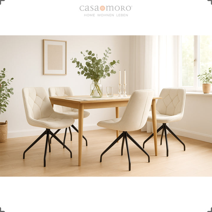 4er-Set  Polsterstühle 360° drehbar in Beige mit schwarzem Metallgestell – helles Esszimmer mit Holztisch, Eukalyptus-Deko und natürlicher Lichtstimmung